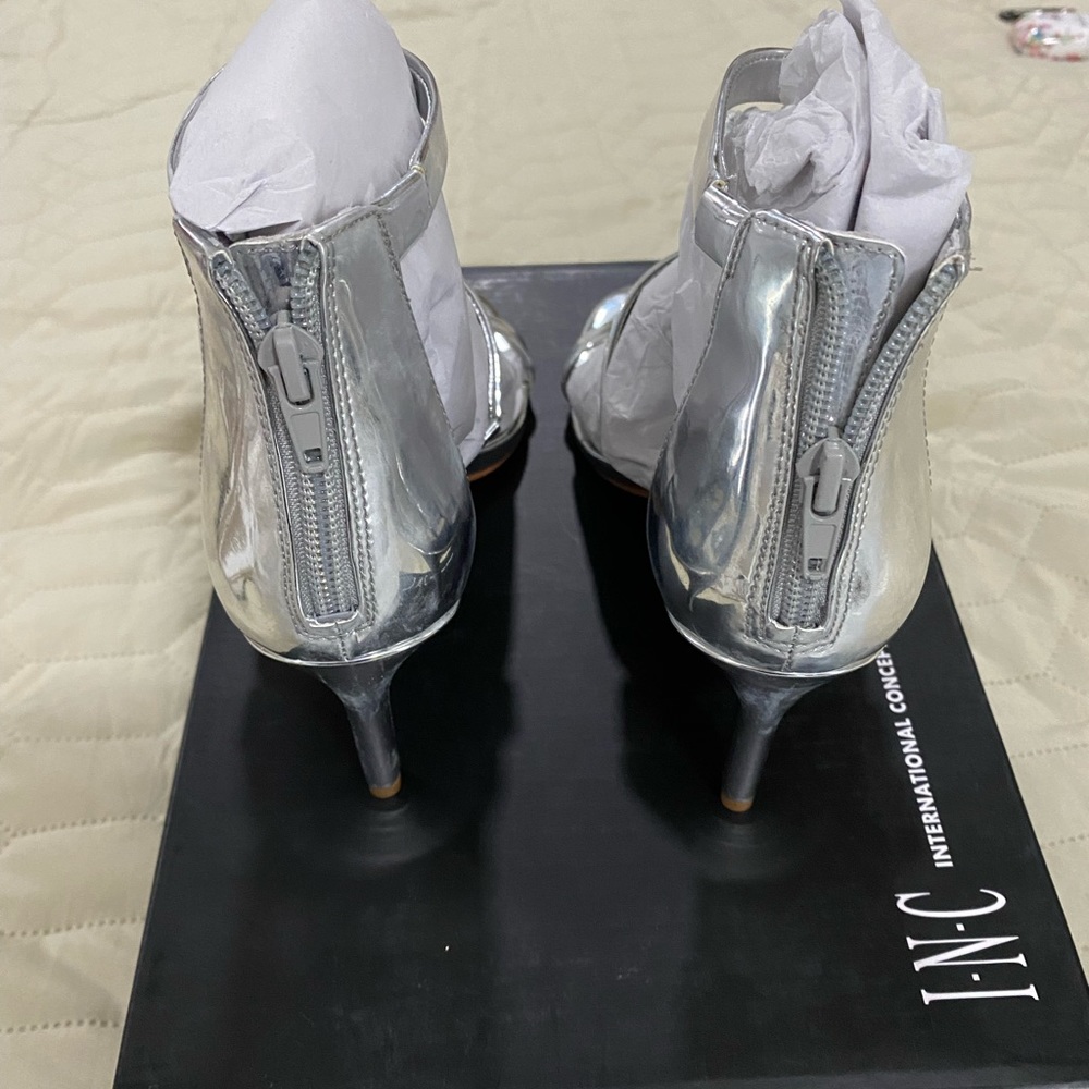 Brand new International Concepts Silver Metallic high heel sandals. Size 6 1/2.